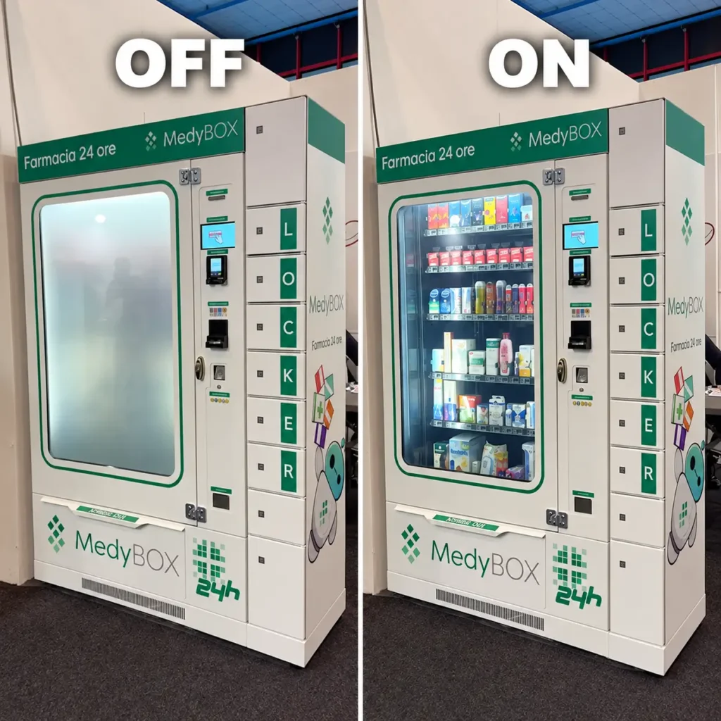 Distributore automatico MedyBOX per farmacia 24 ore con vetrina mostrata in modalità opaca e trasparente, soluzione per privacy, visibilità dei prodotti e gestione intelligente del vetro.